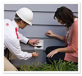 Orkin Man fixing a vent