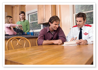 Orkin Man at the table with customers